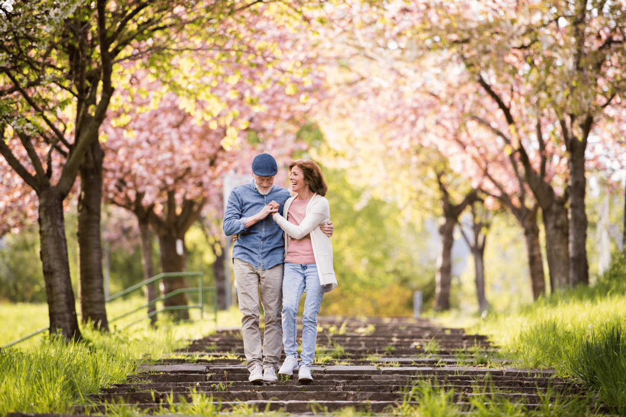 Couple walking in the spring through a park