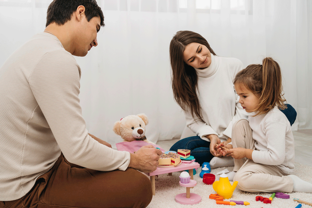 parents playing with daughter Man Sitting alone with phone